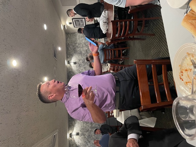 A US Mortgage colleague speaking during a team dinner