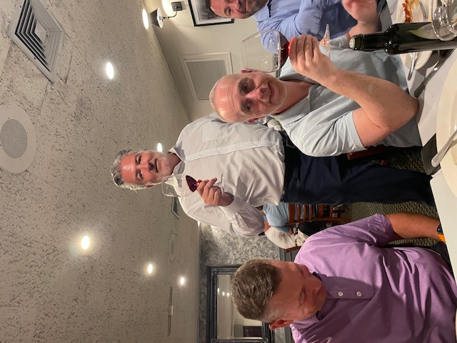 US Mortgage leaders raising a toast at a team dinner