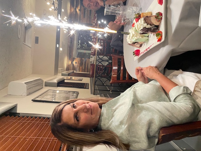 A team celebration shared over dinner