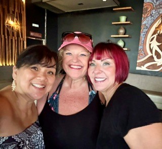 Friends smiling together during President’s Club