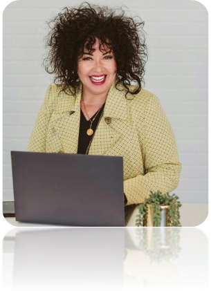 Dominique Love seated at her desk